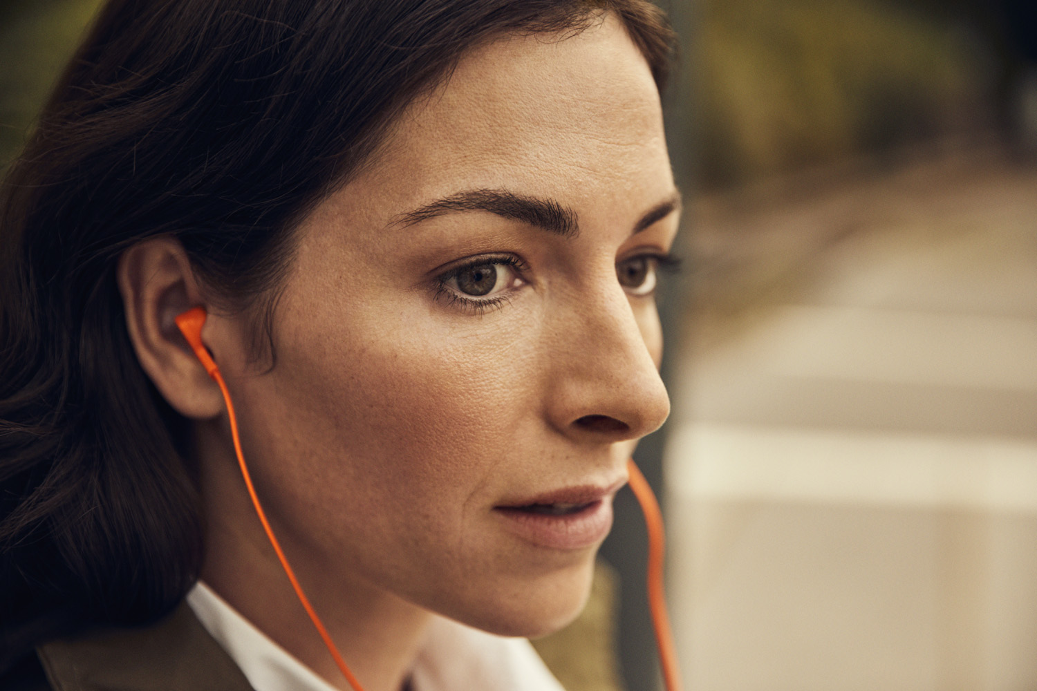 A woman listening to a book.