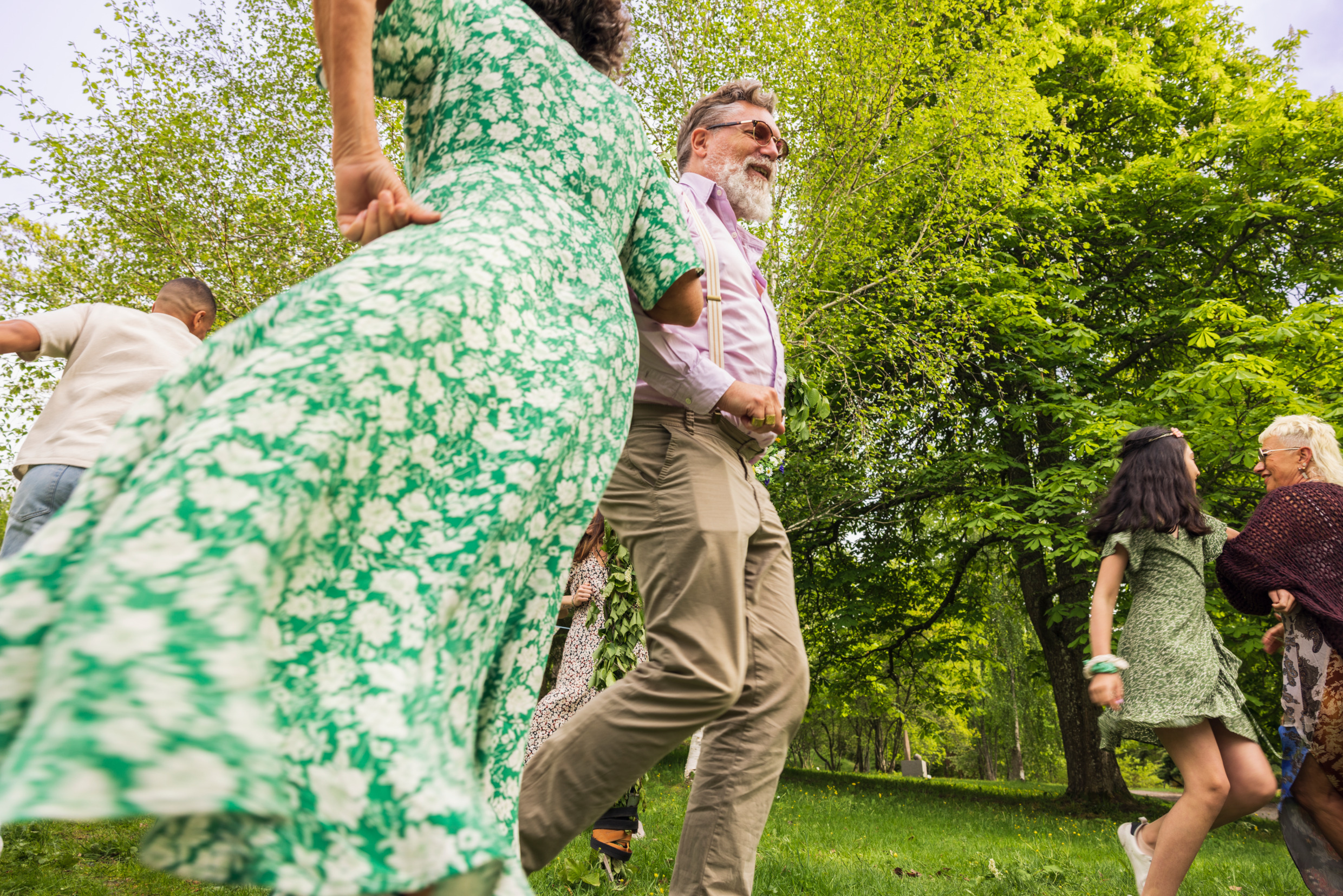 People dancing outdoors in summer