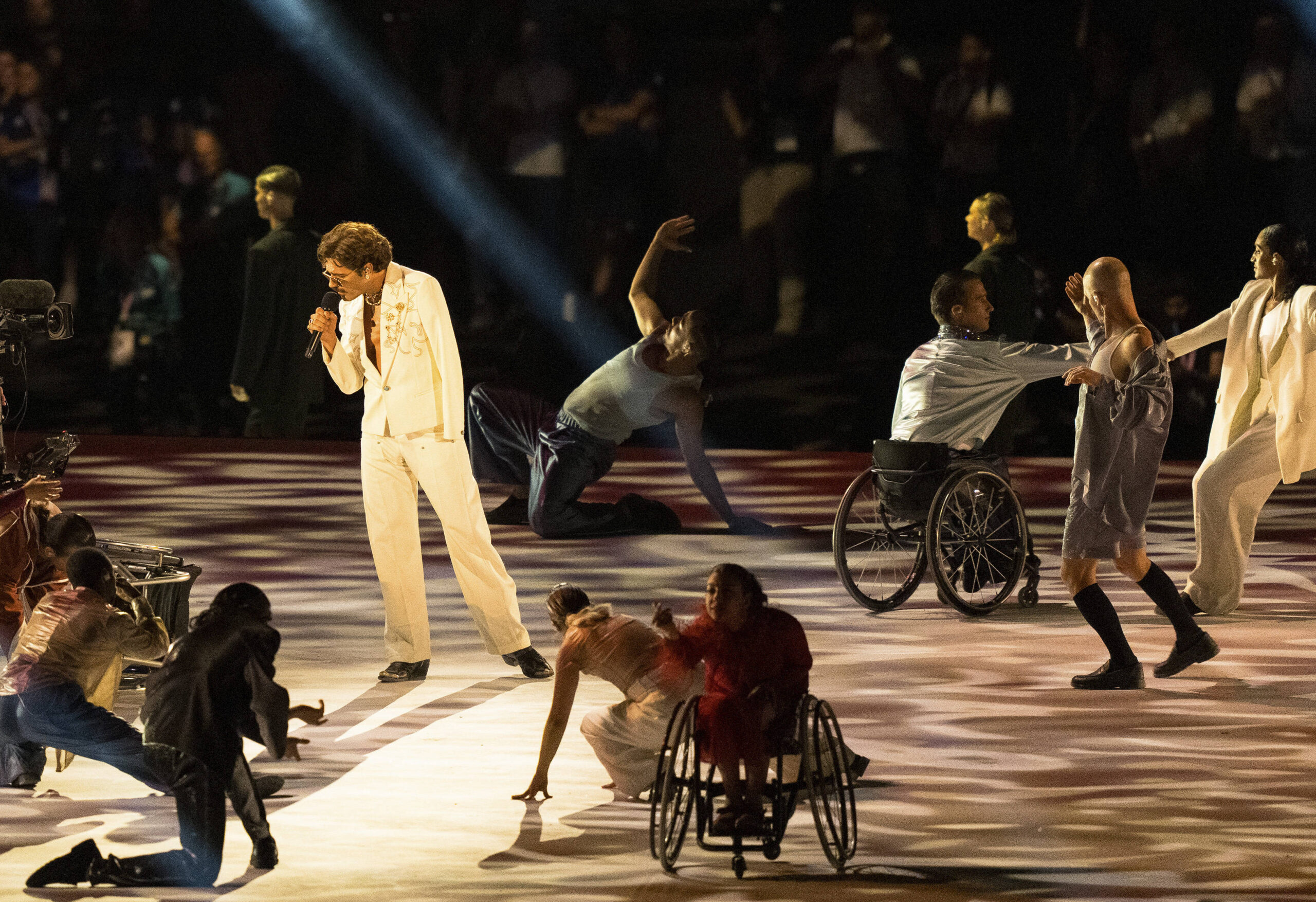 A singer and dancers performing at Paralympics opening ceremony.