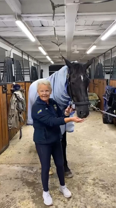 Louise Etzner in the stable with her horse.