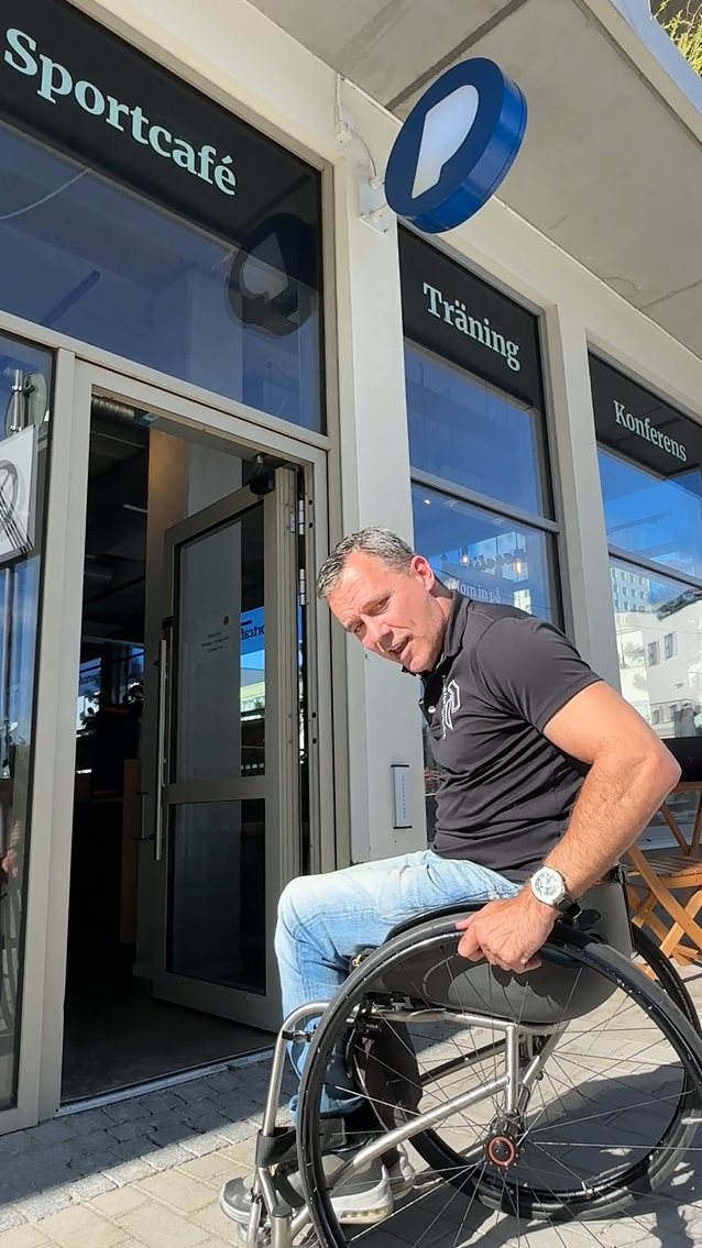 Co-founder Peter entering the café using his wheelchair.