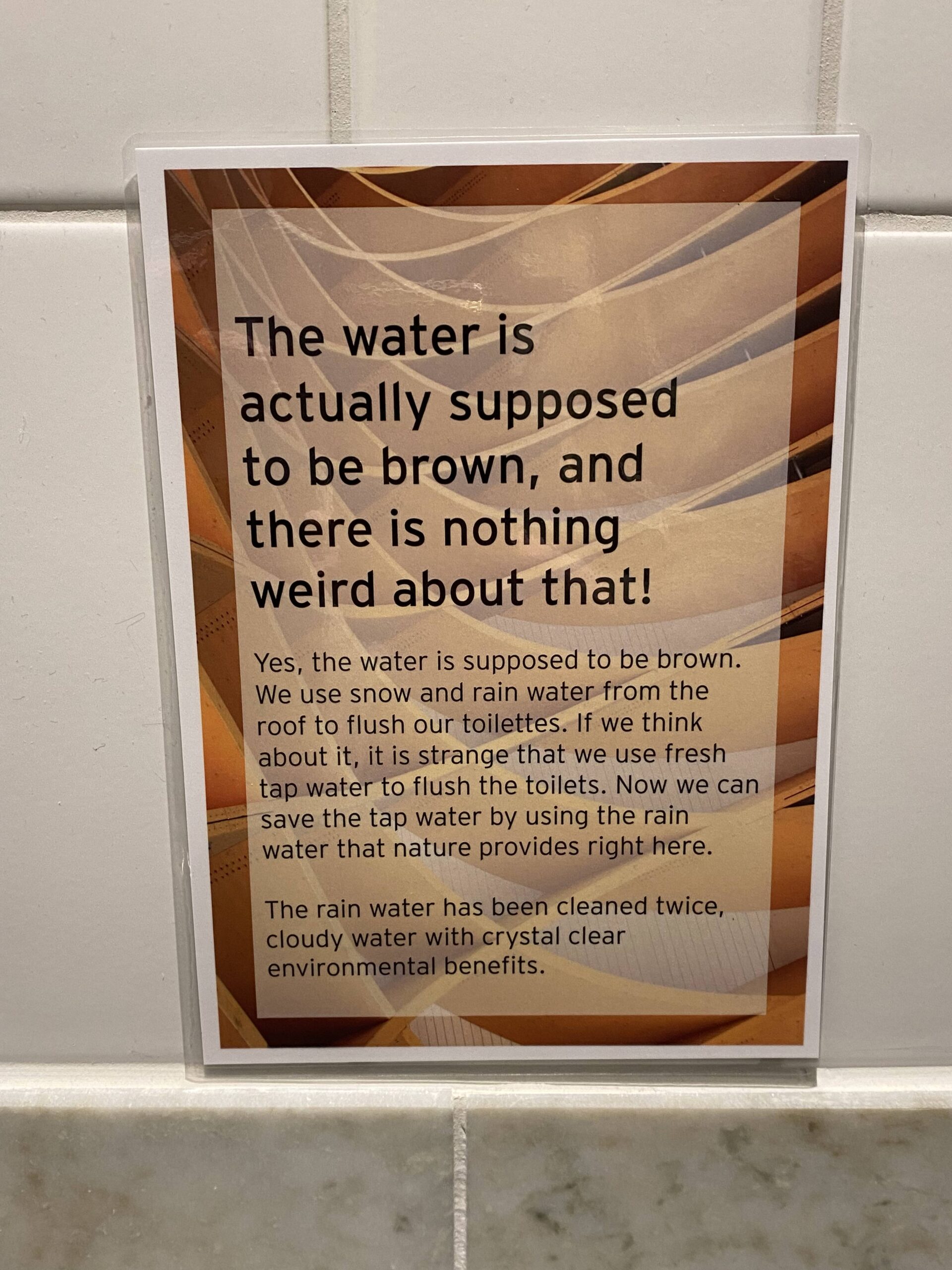 A sign explaining that the water is supposed to be brown.