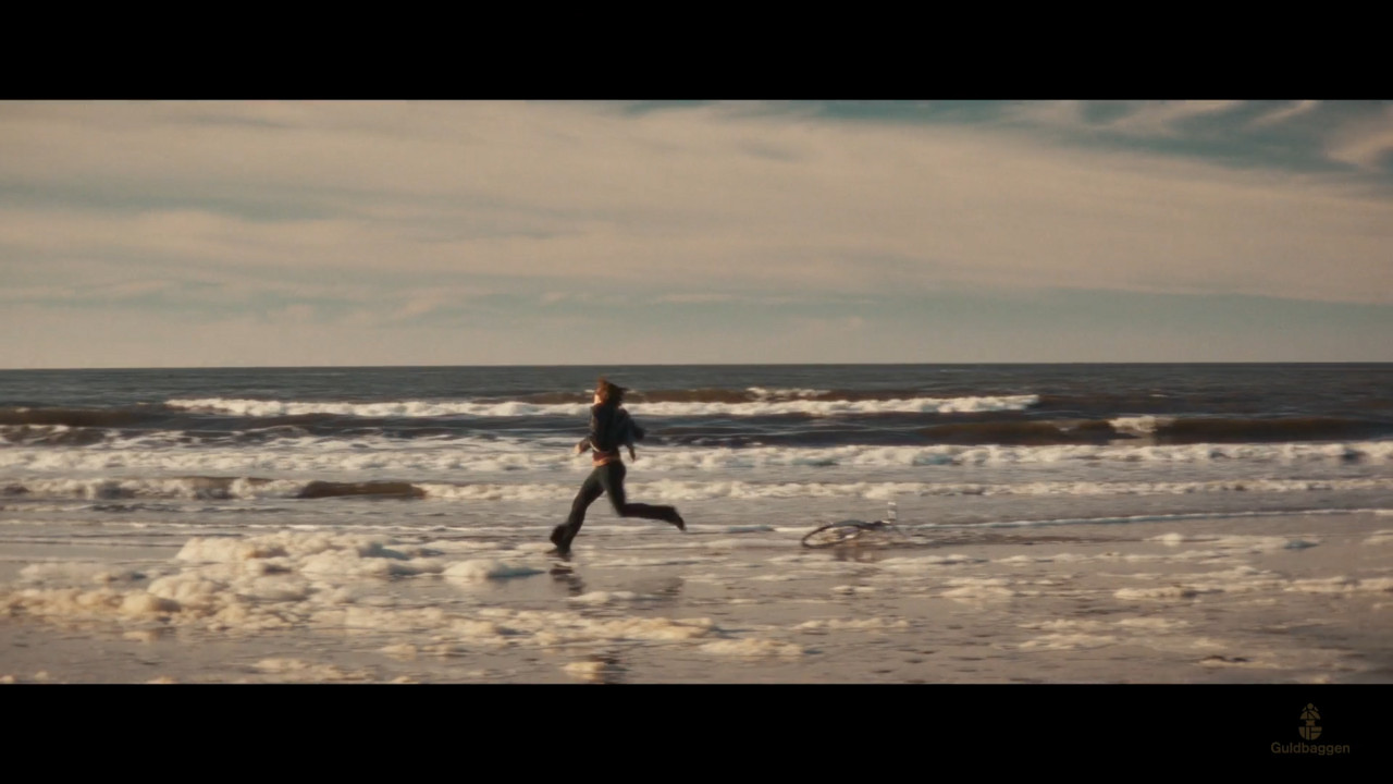 A person running on a beach