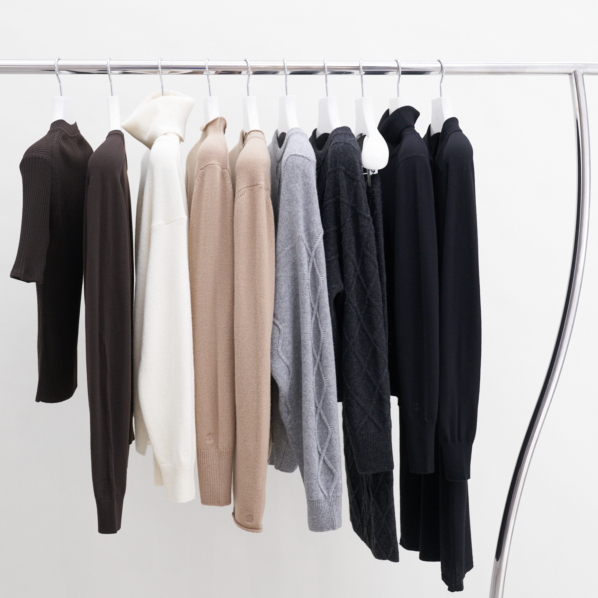 Multiple items on a clothing rack.