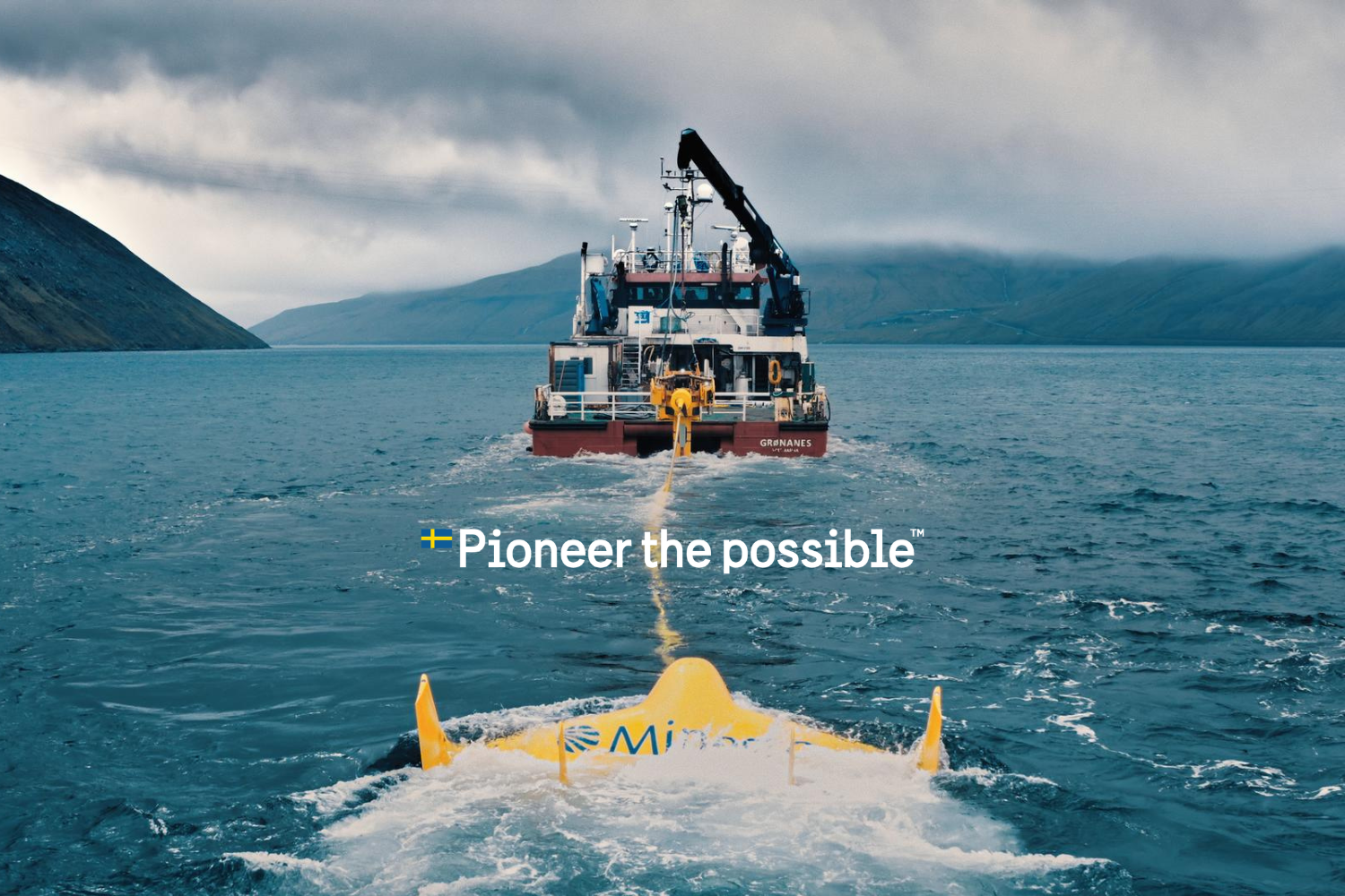 A boat at sea with a yellow device attached to it.